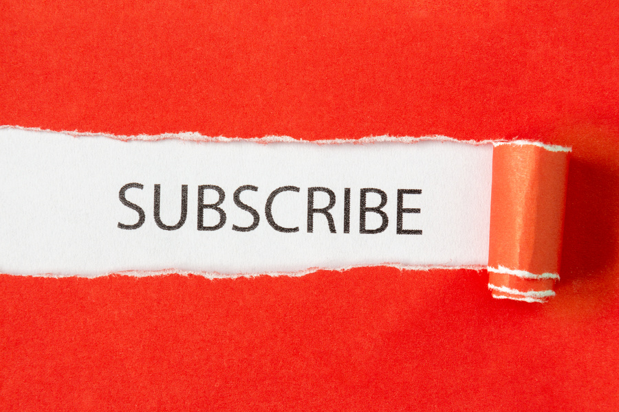 Subscribe Word on Torn Paper